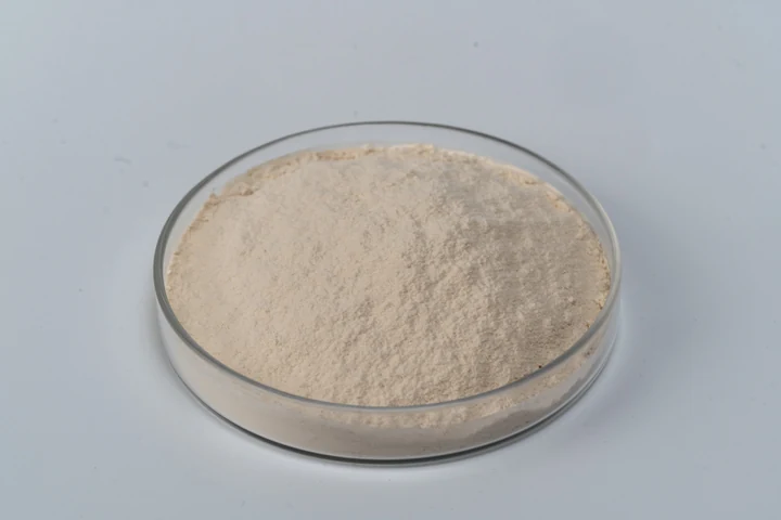 Sodium Carboxymethyl Yeast Beta-Glucan powder sample in a glass dish