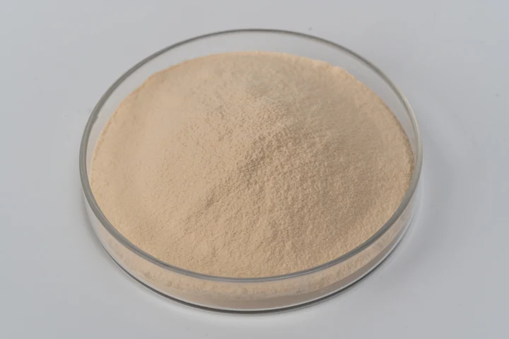 Yeast beta-glucan powder sample in a glass dish
